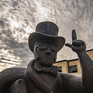 Statue on Ichabod Plaza with cloudy sky