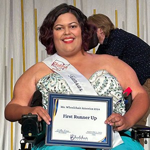 Daija Coleman shows off her first runner-up certificate from the Mrs. Wheelchair America competition
