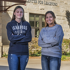 Two students standing outside on the Washburn campus