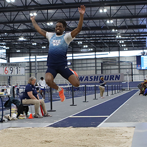 A Washburn jumper competing in the Indoor Athletic Facility