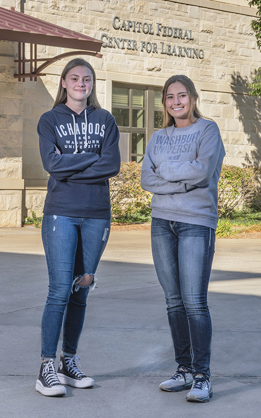 Two students standing outside on the Washburn campus