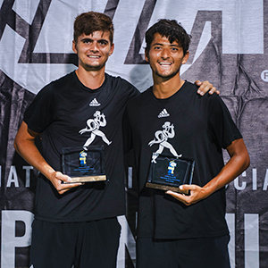 Tim Hammes and Santiago Rendon pose with their trophies after winning the national championship