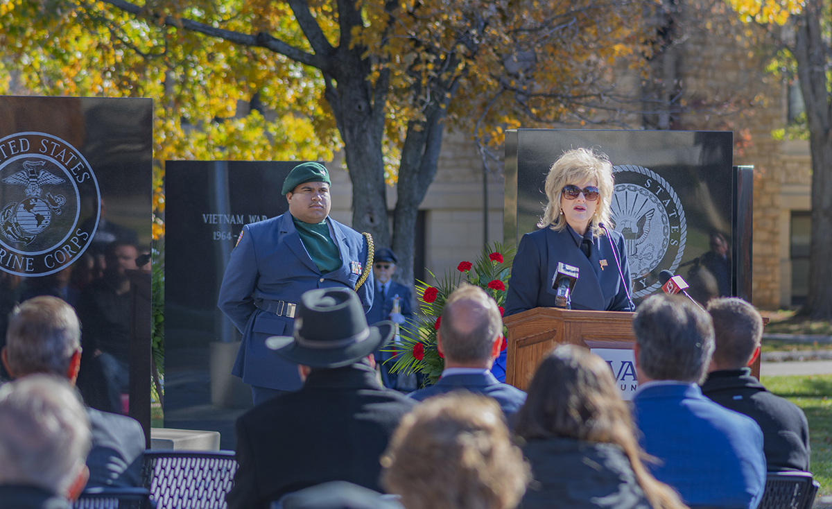 JuliAnn Mazachek, president, Washburn, speaks at the memorial dedication