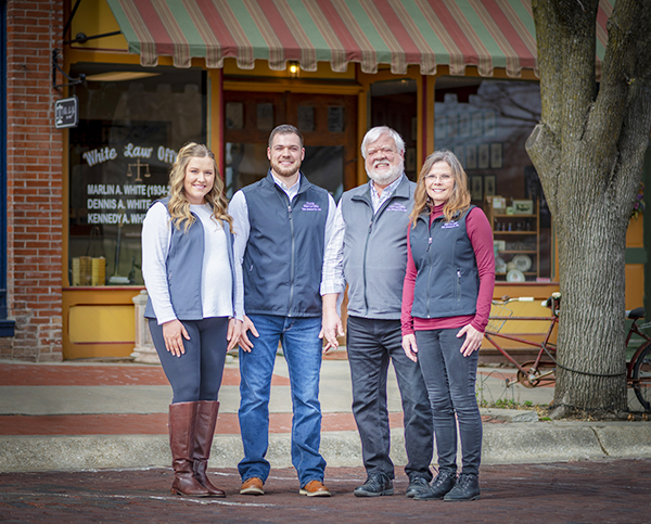 Members of the White family posing outside White Law Office in downtown Holton, Kansas